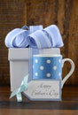 Happy Fathers Gift with blue and white gift on wood background.