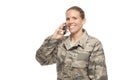 Happy female airman talking on mobile phone