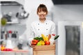 happy female chef with food in box on kitchen Royalty Free Stock Photo