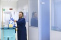 Happy female cleaner smiling in office Royalty Free Stock Photo