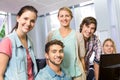 Happy female computer teacher and students Royalty Free Stock Photo