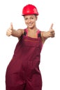 Happy female construction worker showing thumbs up Royalty Free Stock Photo