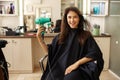 Happy female customer using hairdryer, hairsalon Royalty Free Stock Photo