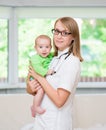 Happy female doctor pediatrician and patient child baby Royalty Free Stock Photo