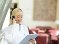 Happy female doctor talking to a patient on a phone Royalty Free Stock Photo