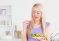 Happy female eating her salad Royalty Free Stock Photo