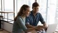 Happy two colleagues working on online project. Royalty Free Stock Photo