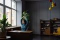 Happy female employee doing stretching exercises at workplace, feeling satisfied with work done Royalty Free Stock Photo