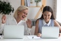 Happy female employee laugh using laptops in office Royalty Free Stock Photo