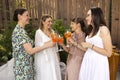 Happy female friends spending time together, young woman drinking Aperol spritz