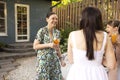 Happy female friends spending time together, young woman drinking Aperol spritz cocktail