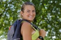 Happy female hiker posing outdoors