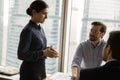 Happy female leader holding negotiations meeting in office. Royalty Free Stock Photo