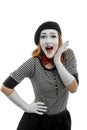 Happy female mime on white background. Vertical portrait of actress Royalty Free Stock Photo