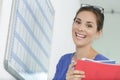 Happy female office worker looking at camera Royalty Free Stock Photo