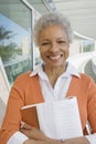 Happy Female Professor With Book