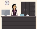 Happy female receptionist standing at hotel