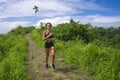 Happy female runner training on countryside road - young attractive and fit jogger woman doing running workout outdoors at Royalty Free Stock Photo