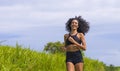 Happy female runner training on countryside road - young attractive and fit jogger woman doing running workout outdoors at Royalty Free Stock Photo