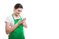 Happy female seller texting on cellphone Royalty Free Stock Photo