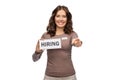 happy female shop assistant with hiring banner