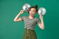 Happy female with smiling, having fun with two silver ballons Royalty Free Stock Photo