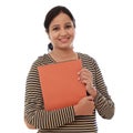 Happy female student holding text book Royalty Free Stock Photo