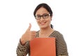 Happy female student holding text book Royalty Free Stock Photo