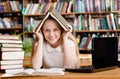 Happy female student in library Royalty Free Stock Photo
