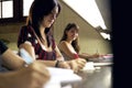 Happy female student smiling at camera in college library Royalty Free Stock Photo