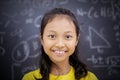 Happy female student standing in classroom Royalty Free Stock Photo