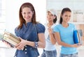 Happy female students in library lobby Royalty Free Stock Photo