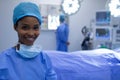 Happy female surgeon sitting in operation theater Royalty Free Stock Photo