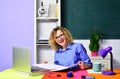 Happy female teacher or student using laptop sitting at desk in university or high school college. Smiling teacher Royalty Free Stock Photo