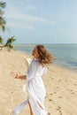 happy female tourist walking on tropical beach Royalty Free Stock Photo