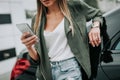 Happy female typing in the mobile outside Royalty Free Stock Photo