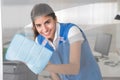 Happy Female Worker Cleaning Glass Window With Rag Royalty Free Stock Photo