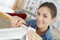 happy female worker fixing chair