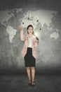 Happy female worker is juggling light bulbs