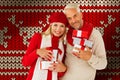 Composite image of happy festive couple with gifts