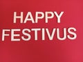 Happy festivus message on a festive red background