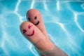 Happy finger couple for a hug in swimming pool