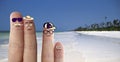 Happy finger face family in the tropical beach with white sand