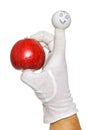 Happy finger puppet holding red apple