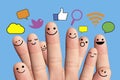 Happy finger smileys with social network sign.