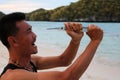 Happy fisherman with halfbeak fish.