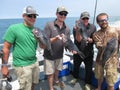 Happy Fishermen and Their Catch Royalty Free Stock Photo