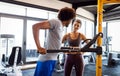 Happy fit friends exercising, working out in gym to stay healthy together Royalty Free Stock Photo