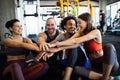 Happy fit friends exercising, working out in gym to stay healthy together Royalty Free Stock Photo