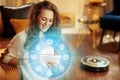 Housewife using smart home application on tablet PC Royalty Free Stock Photo